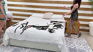 Two Women In Bondage During Intense Group Scene