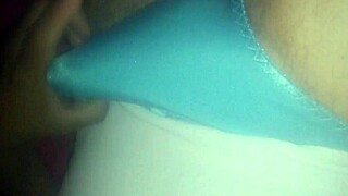 She masturbates using her tiny blue satin shorts today