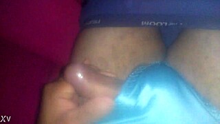 She masturbates using her tiny blue satin shorts today