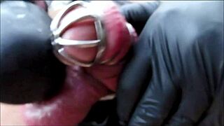 domina madame birgit pisses and forces locked penis to cum