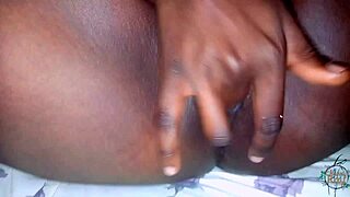 hot ebony goddess teases her juicy tits while slowly sliding fingers down